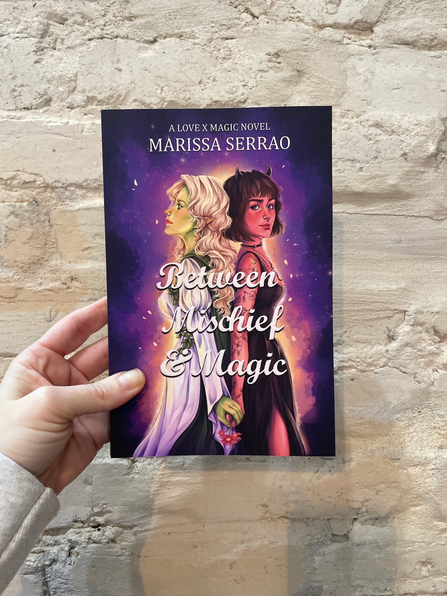 Between Mischief & Magic by Marissa Serrao