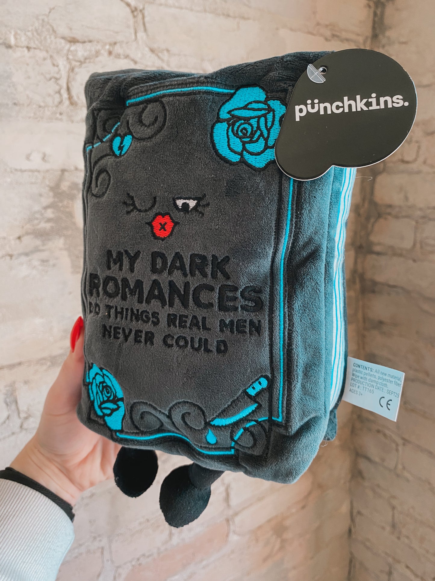 “My Dark Romances Do Things Real Men Never Could” book plushie