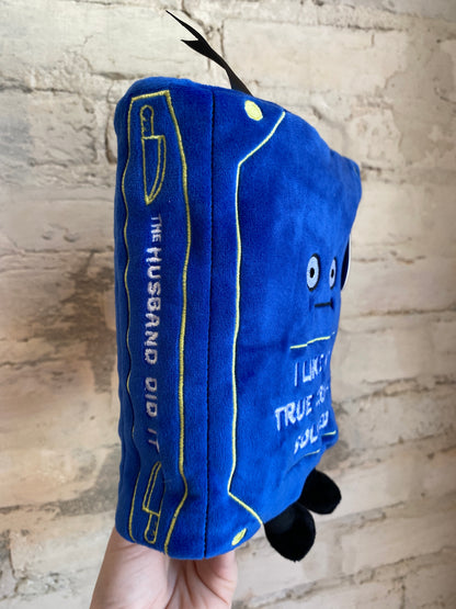 “I Like My True Crimes Solved” book plushie