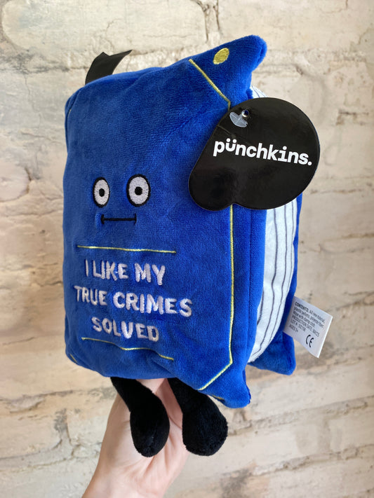 “I Like My True Crimes Solved” book plushie